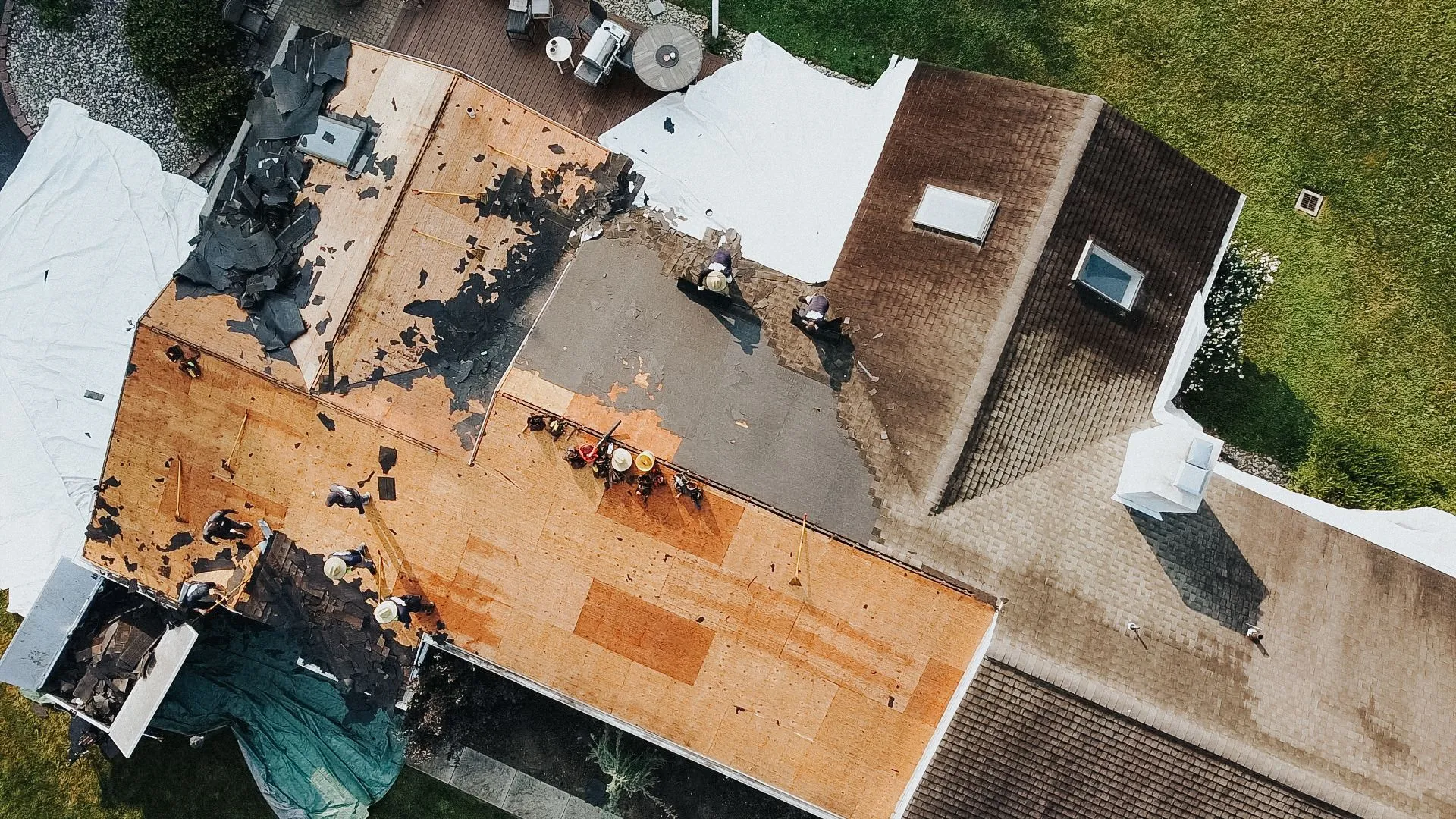 Aerial view of JAB Exteriors crew replacing a roof